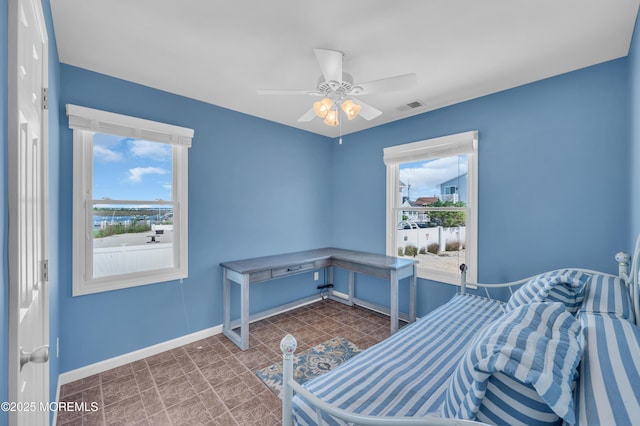 433 Bayside Ter Unit 1, Seaside Heights, NJ 08751 - bedroom with baseboards and ceiling fan