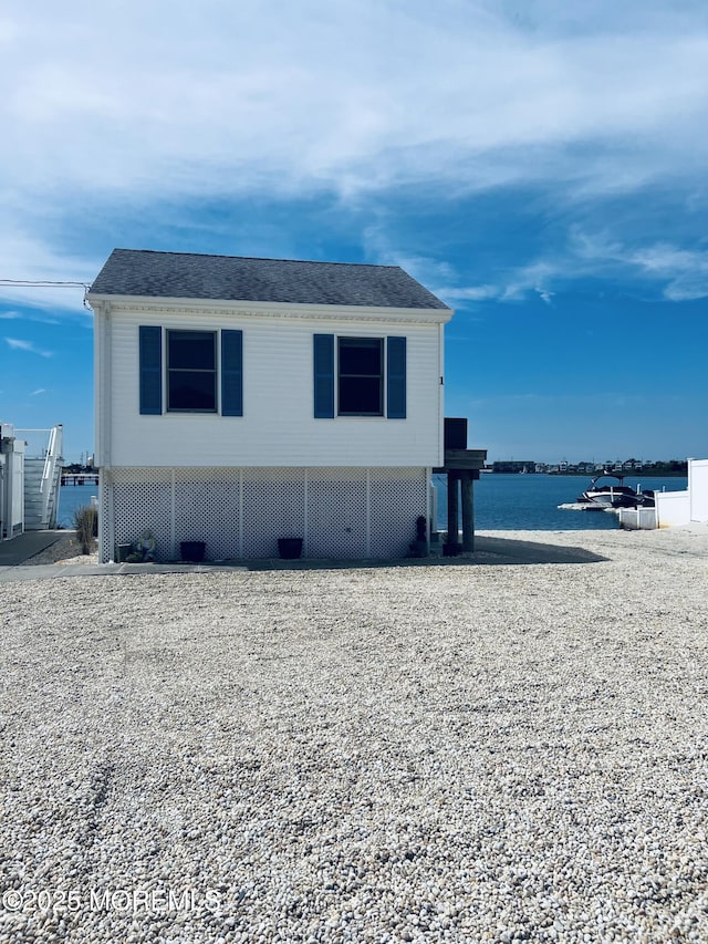 433 Bayside Ter Unit 1, Seaside Heights, NJ 08751 - view of side of property featuring a water view and roof with shingles