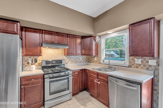 26 Morningside Ave, Keansburg, NJ 07734 - kitchen with stainless steel appliances, a sink, under cabinet range hood, light countertops, and backsplash