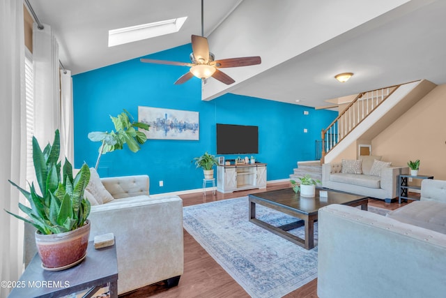 26 Morningside Ave, Keansburg, NJ 07734 - living area with a skylight, wood finished floors, ceiling fan, stairway, and vaulted ceiling