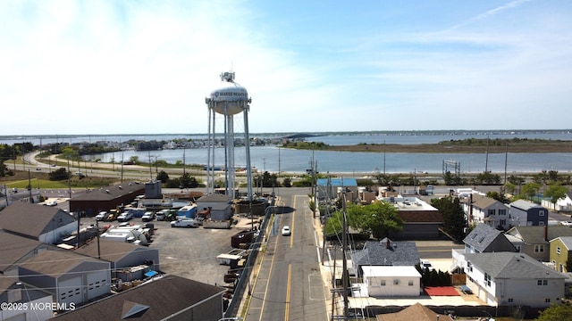 aerial perspective of suburban area with a nearby body of water