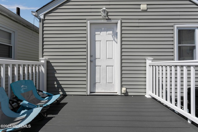 doorway to property with a deck