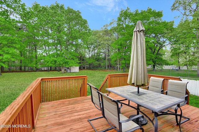 5 Isabella Dr, Lakewood, NJ 08701 - wooden deck featuring outdoor dining space, an outdoor structure, and view of scattered trees