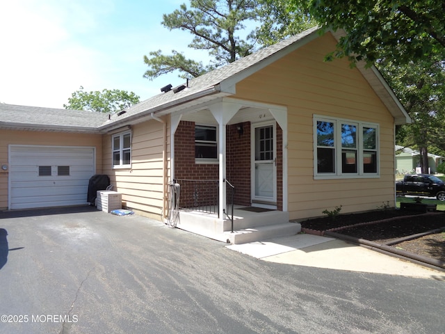 10A Molly Pitcher Blvd, Whiting, NJ 08759 - view of front of house with a garage, driveway, and a shingled roof