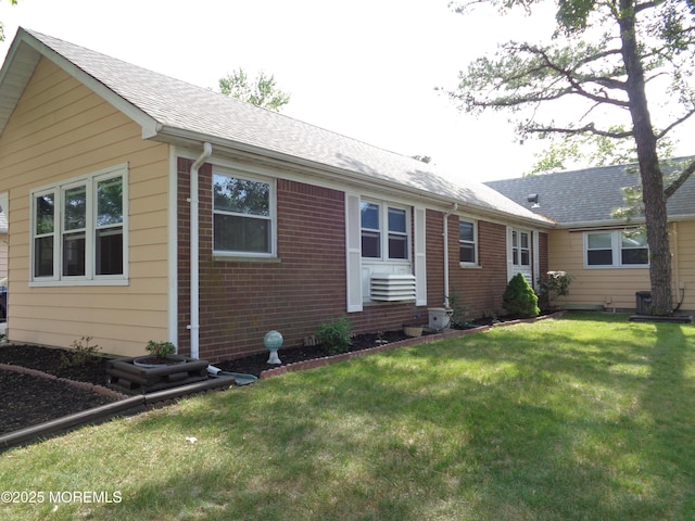 10A Molly Pitcher Blvd, Whiting, NJ 08759 - view of front of home with brick siding, a front lawn, and roof with shingles