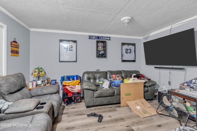 312 Dogwood Dr, Brick, NJ 08723 - living room featuring wood finished floors, crown molding, and a textured ceiling