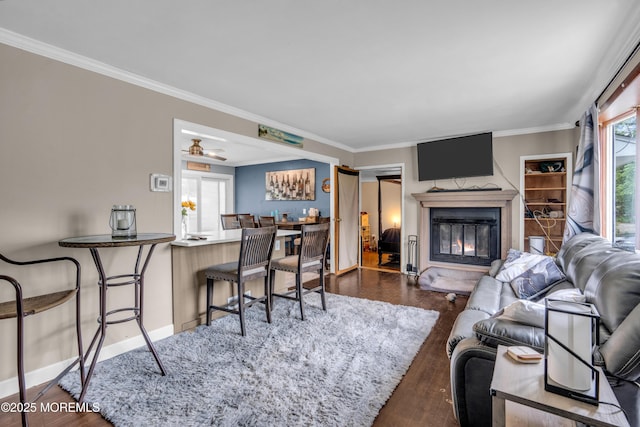 312 Dogwood Dr, Brick, NJ 08723 - living room with a glass covered fireplace, crown molding, wood finished floors, and baseboards