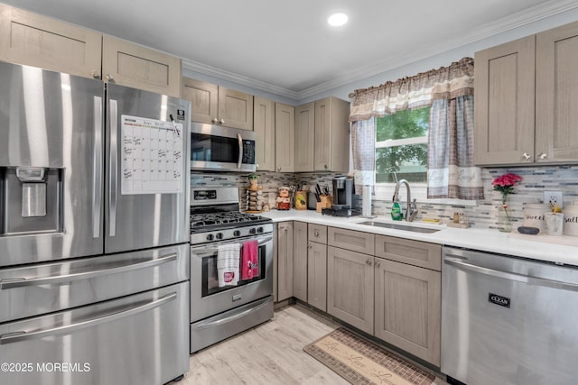 312 Dogwood Dr, Brick, NJ 08723 - kitchen with stainless steel appliances, a sink, light countertops, crown molding, and backsplash