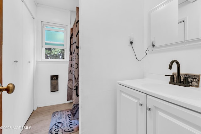 312 Dogwood Dr, Brick, NJ 08723 - bathroom with vanity, wood finished floors, and heating unit