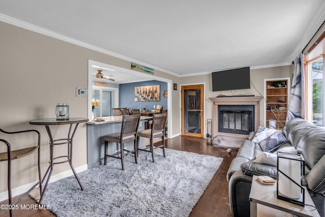 312 Dogwood Dr, Brick, NJ 08723 - living room with baseboards, ornamental molding, wood finished floors, and a glass covered fireplace