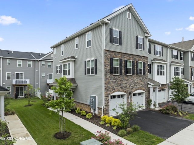 1501 Arose Ln, Middletown, NJ 07748 - townhome / multi-family property featuring stone siding, a garage, a front yard, and asphalt driveway
