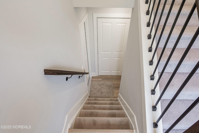 stairs featuring baseboards