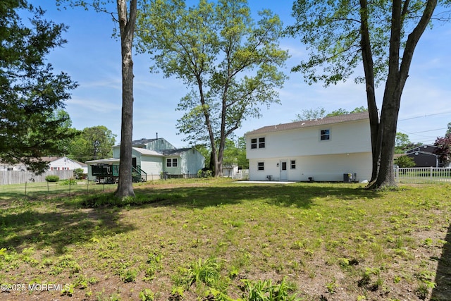 view of yard featuring central air condition unit