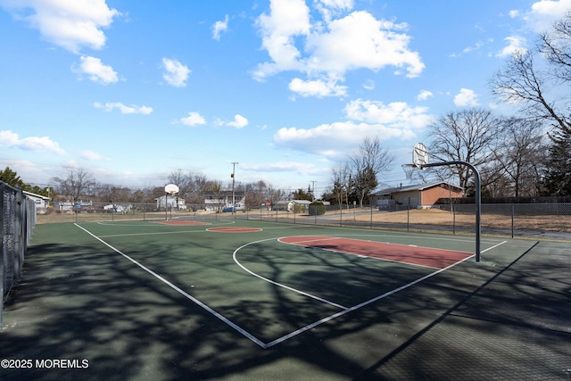 view of sport court featuring community basketball court and fence