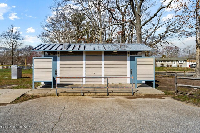 view of outbuilding with fence