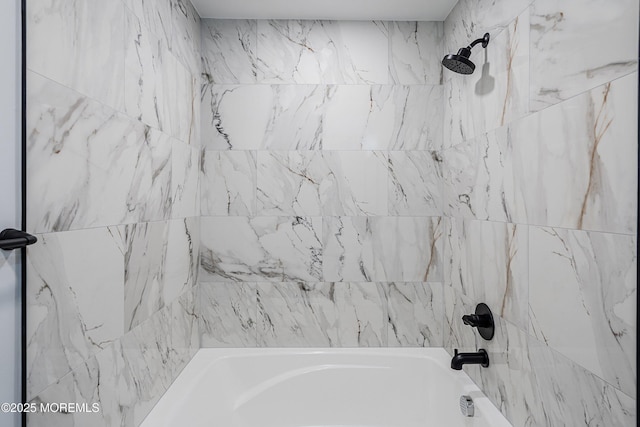 bathroom with tub / shower combination