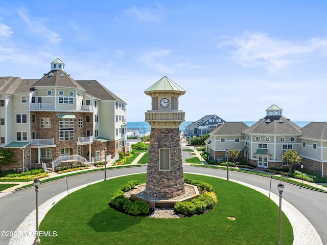 view of home's community featuring a residential view and a yard
