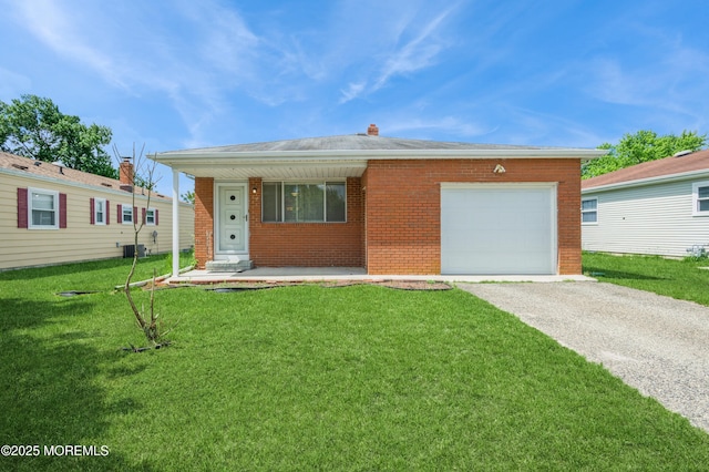 821 Jamaica Blvd, Toms River, NJ 08757 - view of front facade with brick siding, driveway, a garage, a front lawn, and a porch