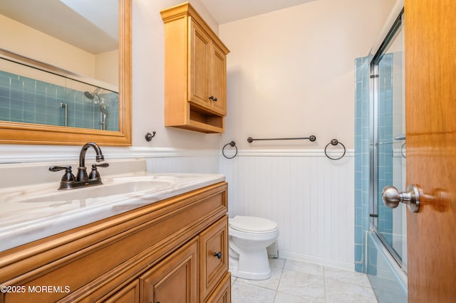 821 Jamaica Blvd, Toms River, NJ 08757 - full bathroom with toilet, a wainscoted wall, vanity, and shower / bath combination with glass door