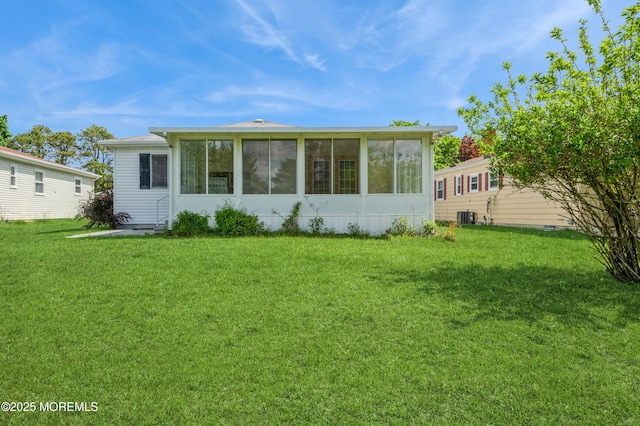 821 Jamaica Blvd, Toms River, NJ 08757 - back of property with a sunroom, a yard, and central AC
