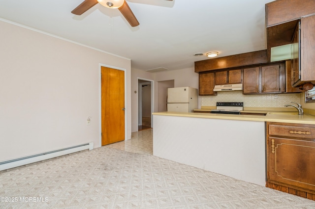 821 Jamaica Blvd, Toms River, NJ 08757 - kitchen with electric stove, under cabinet range hood, freestanding refrigerator, a sink, and tasteful backsplash