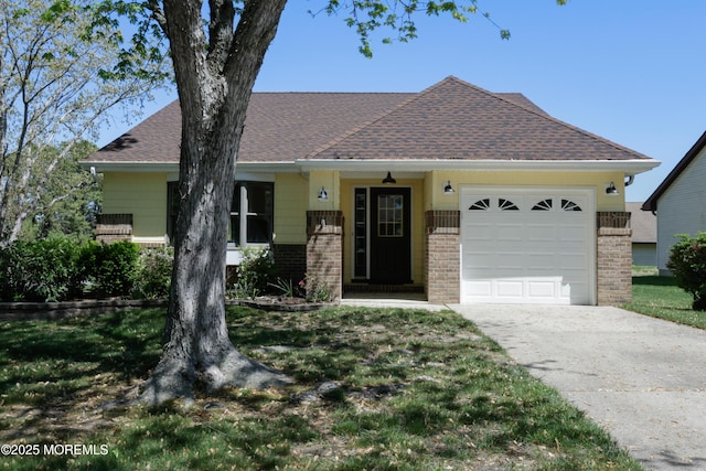 113 Ash Rd Unit 8, Manahawkin, NJ 08050 - view of front of home with brick siding, concrete driveway, roof with shingles, a garage, and a front lawn