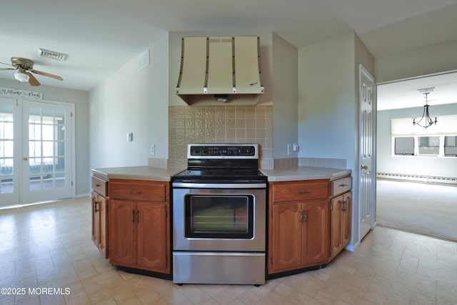 113 Ash Rd Unit 8, Manahawkin, NJ 08050 - kitchen featuring electric stove, a ceiling fan, a baseboard radiator, and light countertops
