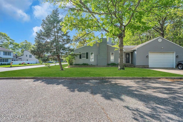 1430 Forest Ave, Brick, NJ 08724 - view of front facade with an attached garage, a front lawn, and driveway