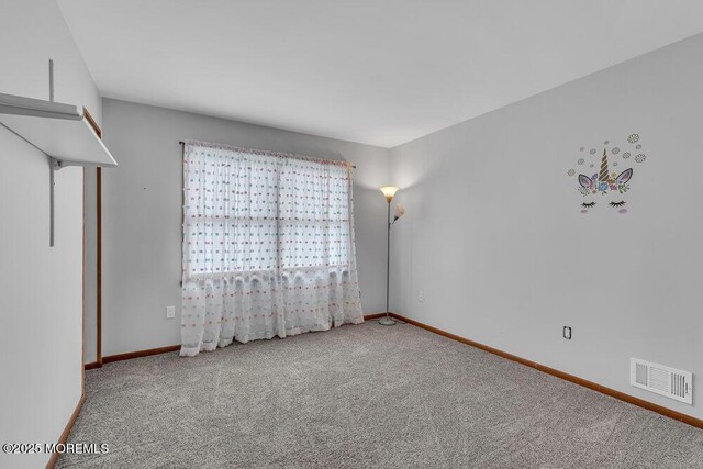 1430 Forest Ave, Brick, NJ 08724 - empty room with carpet floors and baseboards