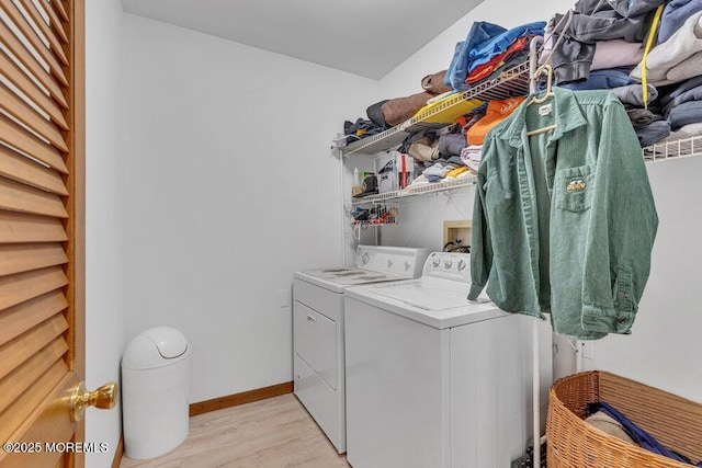 1430 Forest Ave, Brick, NJ 08724 - clothes washing area featuring washing machine and clothes dryer, light wood-style flooring, and baseboards