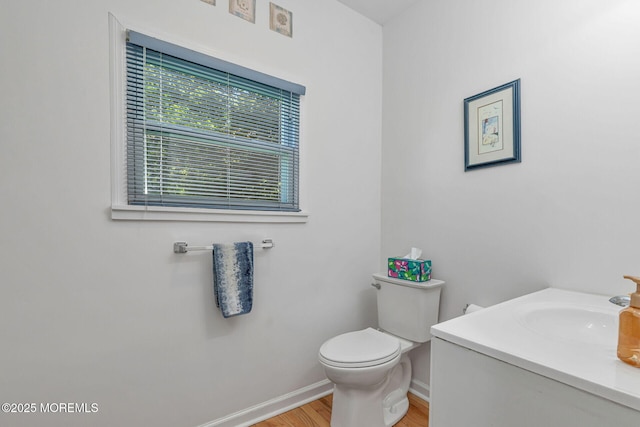 32 Sears Ave, Atlantic Highlands, NJ 07716 - half bathroom with baseboards, wood finished floors, toilet, and vanity