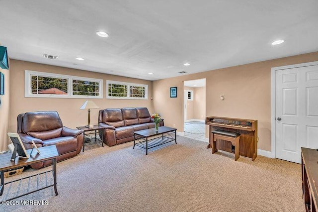 living area featuring light carpet, recessed lighting, baseboards, and plenty of natural light