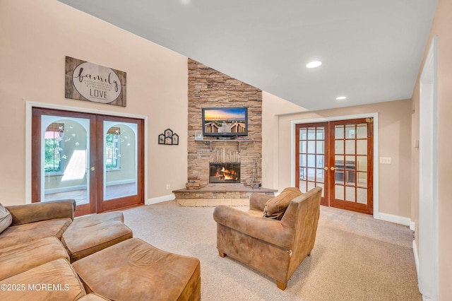 living area with french doors, light carpet, baseboards, recessed lighting, and a fireplace