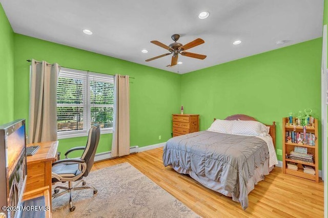 bedroom with wood finished floors, baseboards, recessed lighting, an office area, and a ceiling fan