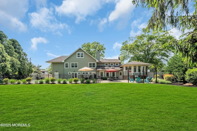 back of property featuring a patio and a chimney