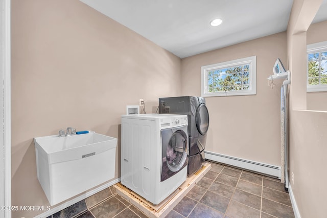 laundry room featuring baseboard heating, separate washer and dryer, baseboards, and recessed lighting