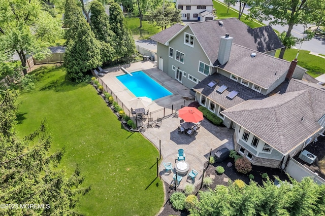 view from above of property with a pool area