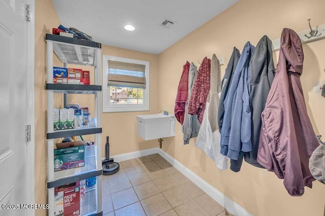 mudroom featuring tile patterned floors, baseboards, and recessed lighting