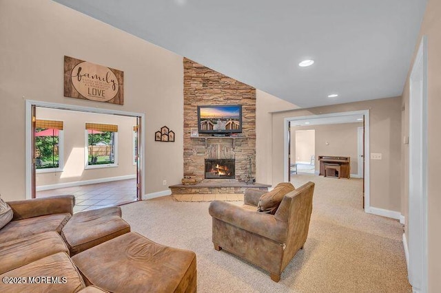 carpeted living room with a fireplace, recessed lighting, baseboards, and a towering ceiling
