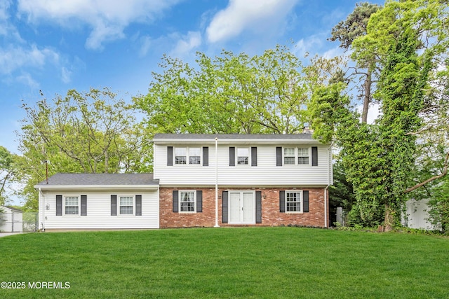132 Tunes Brook Dr, Brick, NJ 08723 - view of front facade featuring a front yard and brick siding