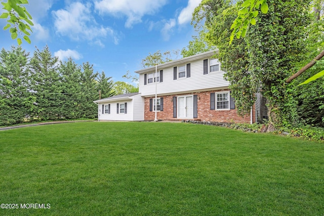 132 Tunes Brook Dr, Brick, NJ 08723 - colonial-style house featuring brick siding and a front lawn