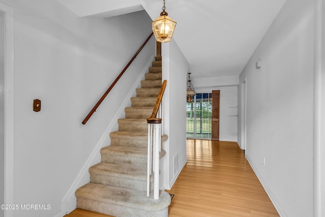 132 Tunes Brook Dr, Brick, NJ 08723 - stairs with wood finished floors and baseboards