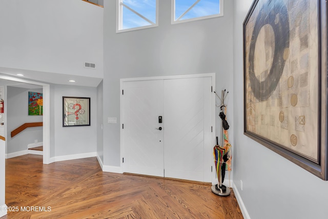 401 Overlook Dr, Neptune Township, NJ 07753 - entryway featuring baseboards, a high ceiling, and parquet flooring