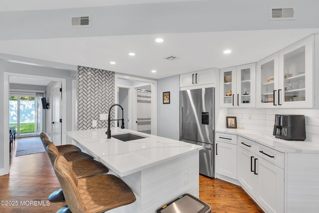 401 Overlook Dr, Neptune Township, NJ 07753 - kitchen with stainless steel fridge with ice dispenser, a sink, backsplash, light stone countertops, and recessed lighting