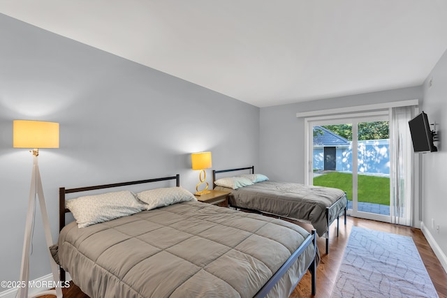 401 Overlook Dr, Neptune Township, NJ 07753 - bedroom with access to exterior, baseboards, and wood finished floors