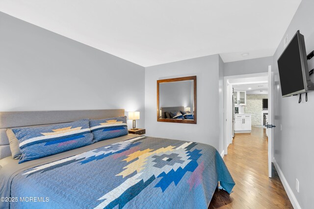 401 Overlook Dr, Neptune Township, NJ 07753 - bedroom with light wood-style flooring and baseboards