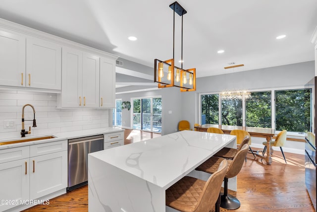 401 Overlook Dr, Neptune Township, NJ 07753 - kitchen featuring stainless steel dishwasher, a sink, a chandelier, recessed lighting, and tasteful backsplash