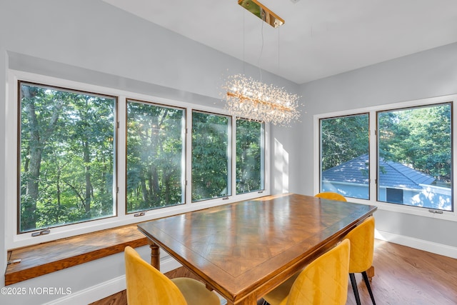 401 Overlook Dr, Neptune Township, NJ 07753 - dining area with plenty of natural light, a chandelier, and wood finished floors