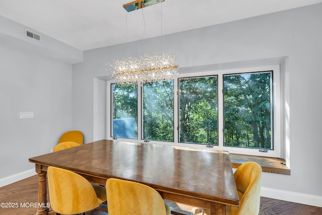 401 Overlook Dr, Neptune Township, NJ 07753 - dining room with healthy amount of natural light, baseboards, and a chandelier