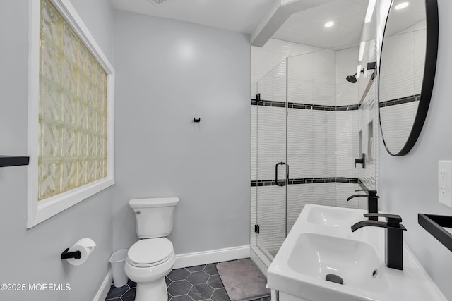 401 Overlook Dr, Neptune Township, NJ 07753 - full bathroom featuring dual sinks, toilet, baseboards, tile patterned flooring, and a stall shower